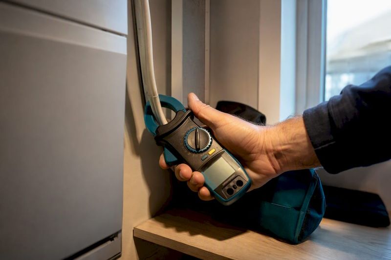 Engineer checking an existing air conditioning system